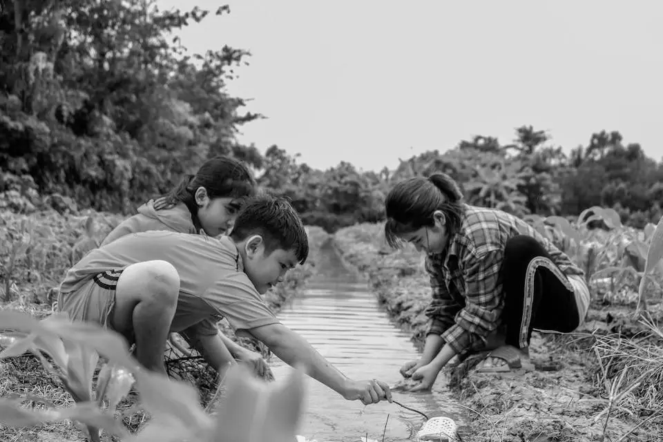 Vietnamese kids playing by the river Vietnamese kids playing by the river