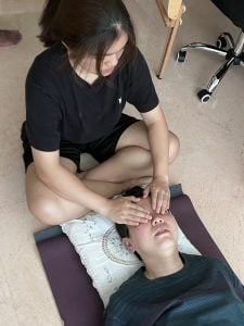 Students of Reiki 1 workshop on 25 May 2025 doing reiki healing on each other