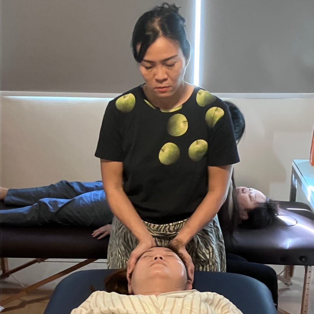 Students of Reiki 1 workshop on 14 Jun 2025 practicing reiki on each other