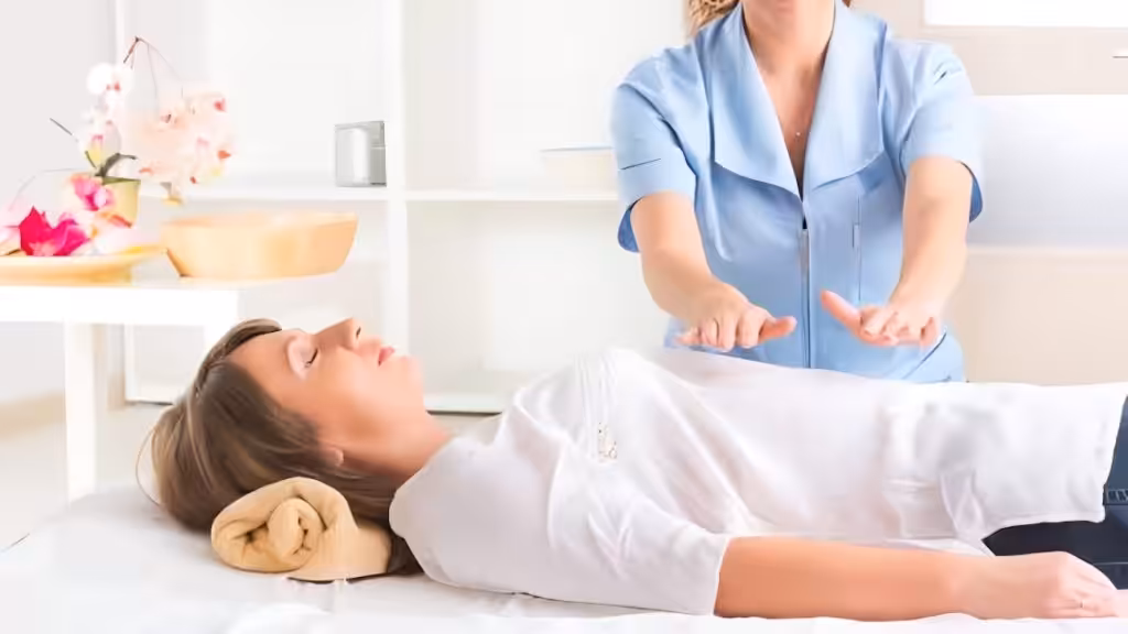 A woman receiving reiki healing