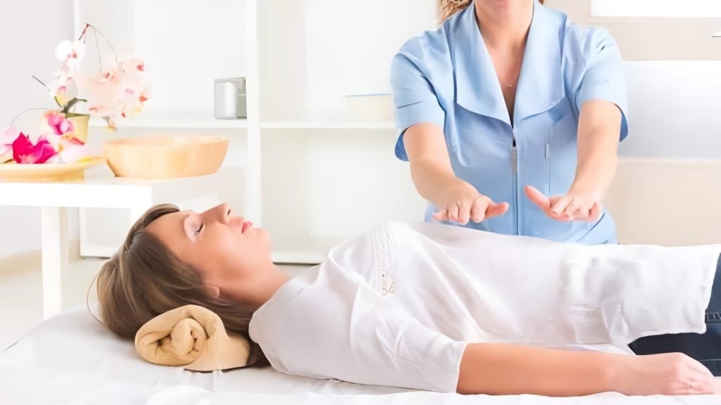 A woman receiving reiki healing