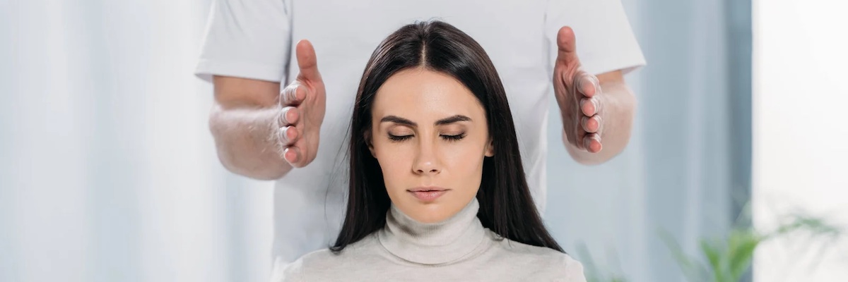A woman feeling reiki healing