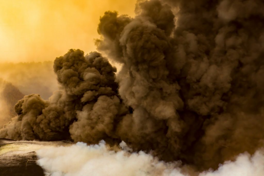 Thick black smoke engulfs the village