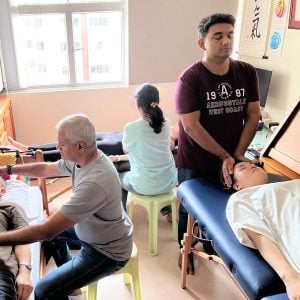 Students of Reiki 1 workshop on 4 Oct 2025 practicing reiki on each other